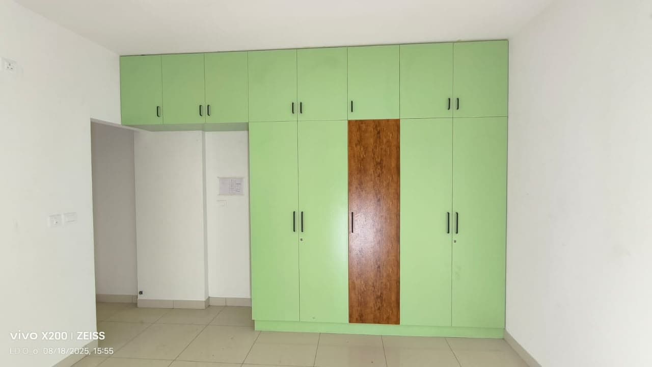 Custom lime green UPVC wardrobe with wood-accent door panel